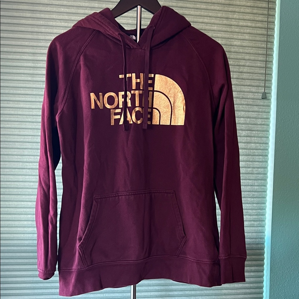 The North Face Burgundy Hoodie with Metallic Gold Logo